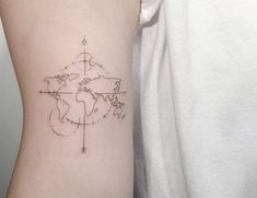 a woman's arm with a world map tattoo on the left side of her body