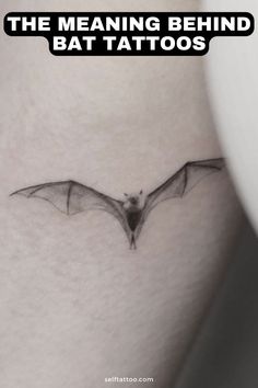 a bat tattoo on the thigh with text that reads, the meaning behind bat tattoos