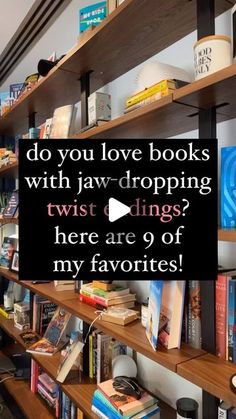 a book shelf filled with lots of books next to a wall covered in bookshelves