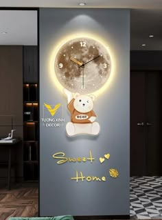 a wall clock with a teddy bear on it and the words sweet home written below