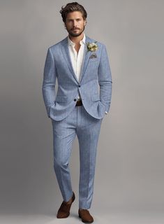 Upgrade your suit game with our Italian Linen Artisanal Light Blue Suit. The subtle blue tone complements solid patterns, adding a touch of sophistication to your overall look. Crafted from pure linen fabric, this suit boasts a cool and sleek aesthetic that will revitalize your fashion sense. It eliminates any uncertai Summer Suits For Men Wedding, Steel Blue Groom Suit, Dusty Blue Mens Suit Wedding, Light Blue Linen Suit Men, Light Blue Mens Wedding Suit, Heather Blue Suit Wedding, Groom Style Summer Wedding, Mens Colored Suits, Dusty Blue Champagne Wedding Color Schemes