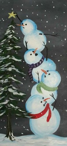 three snowmen are standing in front of a christmas tree