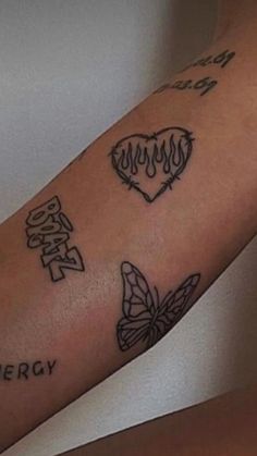 a woman's arm with tattoos on it and the words energy written in different languages