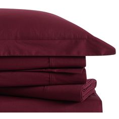 the sheets and pillowcases are folded neatly on top of each other in maroon