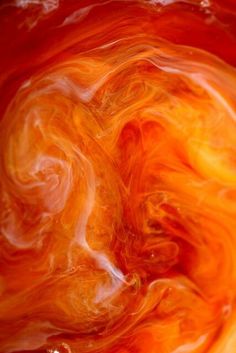 an orange and yellow swirl is seen in this image