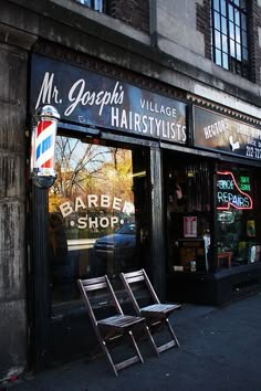 an empty chair sitting outside of a barber shop