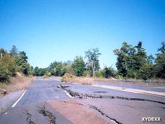 a road that has been blocked off with mud and water from the side of it