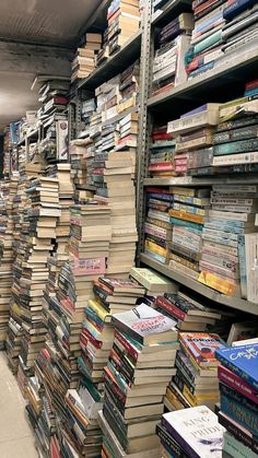 a large amount of books are stacked on the shelves