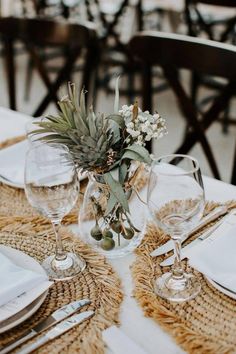 the table is set with place settings and silverware