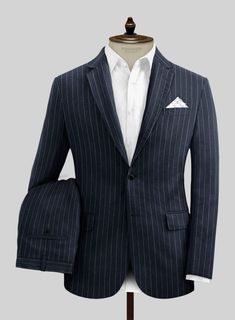 Ignite your confidence with our Solbiati Dark Blue Stripe Linen Suit – a symbol of refined fashion. Crafted with meticulous attention to detail from luxurious linen fabric, its deep blue hue exudes opulence, complemented by the subtle sophistication of sleek stripes. More than just attire, this fabric embodies your refined taste and appreciation for life's finer elements. Whether for daytime ventures or evening affairs, this suit ensures you're impeccably dressed. 
     About Solbiati Pericle Collection :  A blend of artisan craftsmanship and the finest linen, designed for those who cherish classic elegance with a modern twist. Our collection offers unparalleled comfort and impeccable style. With the freedom to explore vibrant textures and colors, from sophisticated two-tone twills to live Luxury Linen Suit With Suit Collar, Luxury Linen Suits, Elegant Cotton Wedding Suit, Elegant Wedding Cotton Suits, Luxury Cotton Suits With Notch Lapel, Blue Single-breasted Linen Suit, Blue Linen Single Breasted Suit, Blue Linen Single-breasted Suit, Elegant Semi-formal Linen Sets