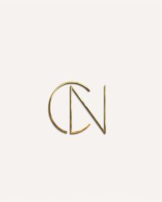 the letter n is made out of gold metal