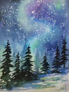 a card with trees and snow in the night sky, on a white tablecloth