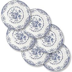 six blue and white plates stacked on top of each other in the shape of flowers