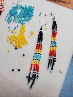 Fire white earrings in a Native American desert fire color style. I use real Czech glass seed beads. Measures 4 inches from bottom of ear wire. All my items are handmade by me a proud Member of the Chippewa Tribe of Turtle Mountain. Gold Hill, Shoulder Duster Earrings, Duster Earrings, Beaded Jewelry Earrings, Beaded Earrings Tutorials, Beaded Jewelry Designs, Beaded Earrings Patterns, Dusters, Purple Earrings