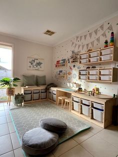 a child's playroom with toys and decor on the walls, flooring