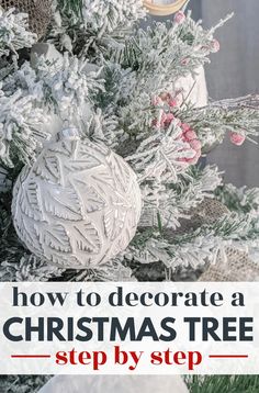 a christmas tree with ornaments hanging from it and the words how to decorate a christmas tree step by step