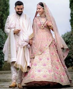 the bride and groom are walking together