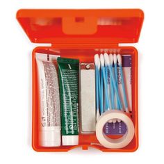 an orange case filled with different types of toothpaste and other dental care items