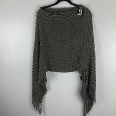 Poncho One Size Gray And Gold String Fringe At The Bottom Lightweight 100% Acrylic Cozy Good Conditions A Few Strings Are Apart On The Inside Gray Knitted One-size Sweater, Gray Knitted Sweater One Size, One-size Knitted Gray Sweater, One Size Gray Knitted Sweater, Casual Gray Knit Poncho, One Size Gray Knit Sweater, Hand Knit Poncho, Plaid Shawl, Turtleneck Poncho