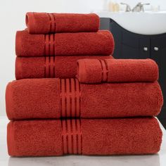 six red towels stacked on top of each other