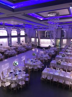 a large banquet hall with tables and chairs