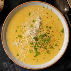 a bowl of soup with cheese and parmesan