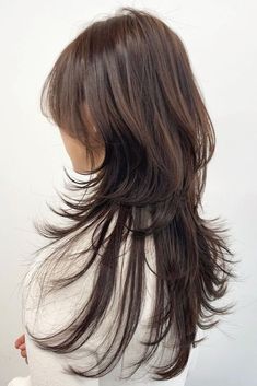 the back of a woman's head with long hair