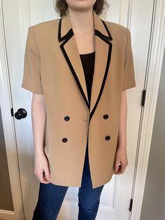 "GIRL BOSS. This late 1990s/Early 2000s black and camel two-piece suit is the ensemble you need in your wardrobe. New with tags and in perfect condition. The model is wearing the top alone in an oversized fashion and it is sharp! Double-breasted and notch lapels. Black creased pants, with single a button, and pleats.  Le Suit  Size 16 19.5\" wide jacket 31\" long jacket 17.5\" wide pants 43\" long pants Model is 5'8\" and 135 pounds" 135 Pounds, Short Sleeve Suit, Oversized Fashion, Pants Model, Womens Suits, Le Suit, Long Jacket, Wide Pants, Early 2000s