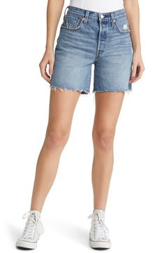 Raw hems and strategic whiskering add to the vintage vibe of slightly stretchy denim shorts that hit at the mid thigh for a look that's comfy and classic. 6" inseam; 19" leg opening; 11" front rise; 13" back rise (size 29) 99% cotton, 1% elastane Machine wash, tumble dry Imported Mid Thigh Denim Shorts, Shorts Nordstrom, Levi Jean Shorts, Mid Thigh Shorts, Mid Rise Shorts, Denim Cutoff Shorts, Denim Cutoffs, Levi's 501, Levis Denim