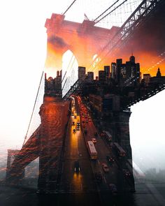 an aerial view of the brooklyn bridge at sunset, with cars driving on it and buildings in the background