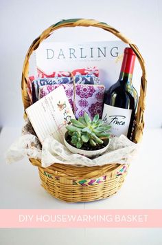 a wicker basket filled with wine bottles and other items next to a sign that says darling