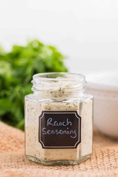 a jar filled with ranch seasoning sitting on top of a table