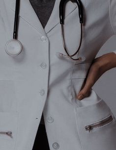 a person wearing a white lab coat with a stethoscope on their chest