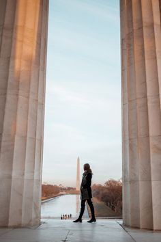 a woman standing in front of the washington monument