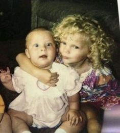 two young children sitting next to each other