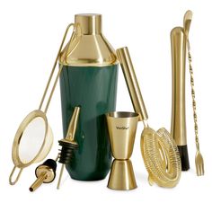 gold and green cocktail set with shakers, cups, spoons and utensils