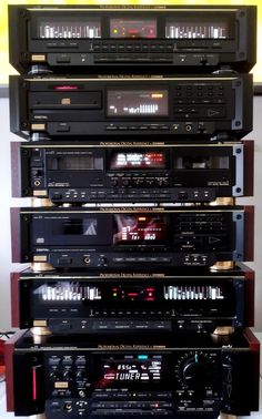 a stack of stereo equipment sitting on top of each other