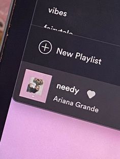 a cell phone displaying the new playlist on its screen