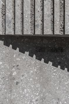 the words at tanco are etched into concrete