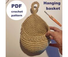 a crochet basket being worked on by someone