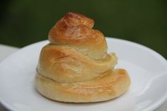 a white plate topped with two rolls on top of each other