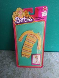 a barbie doll is in the package with its clothes on it's back side