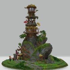 a very tall tower sitting on top of a lush green hillside next to a forest