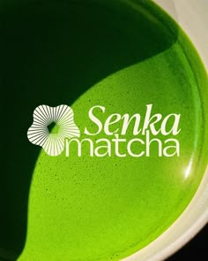 a green bowl with the logo of senda matcha on it's side