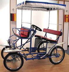 an old fashioned tricycle is on display in a museum