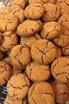 a pile of cookies sitting on top of a metal rack