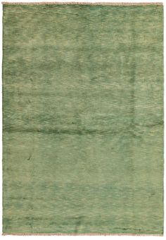 an old green rug with faded edges