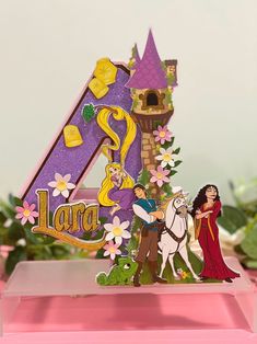 an image of a birthday card with princess and prince on the letter s in front of a castle