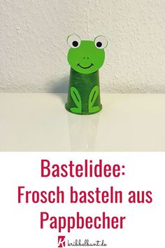 a green frog sitting in front of a white wall with the words bastelldee frosch basteln aus pappecher