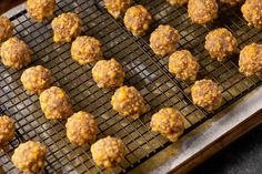 several balls of food sitting on top of a metal rack next to a cooling rack